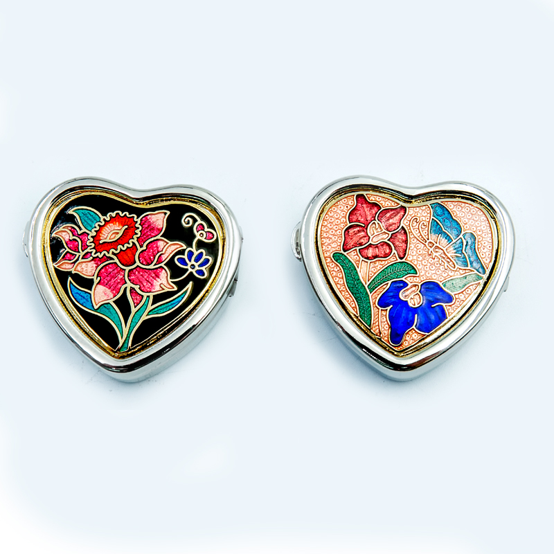 small heart-shaped enamel pill box